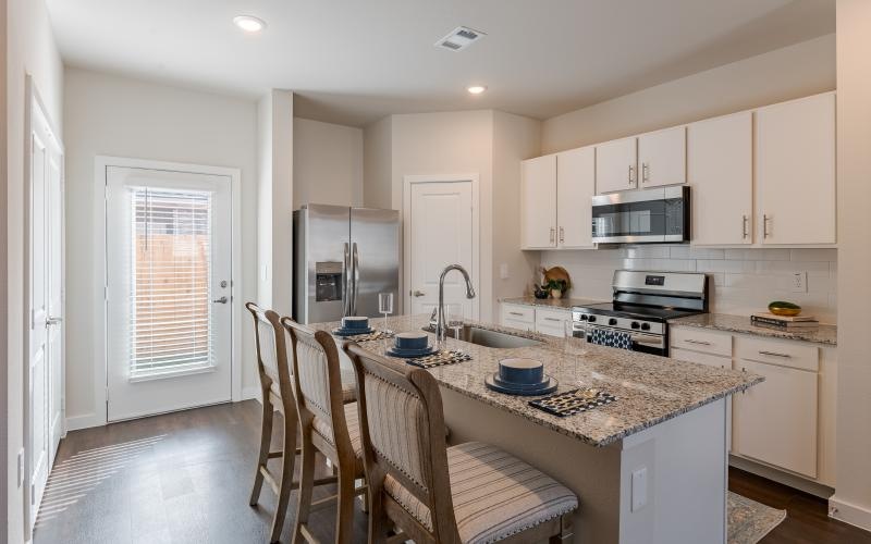 a kitchen with white cabinets